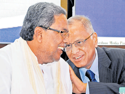 Siddaramaiah (left) and N&#8200;R&#8200;Narayana Murthy share a light moment at IACC&#8200;Conclave in Bengaluru on Friday. DH&#8200;Photo