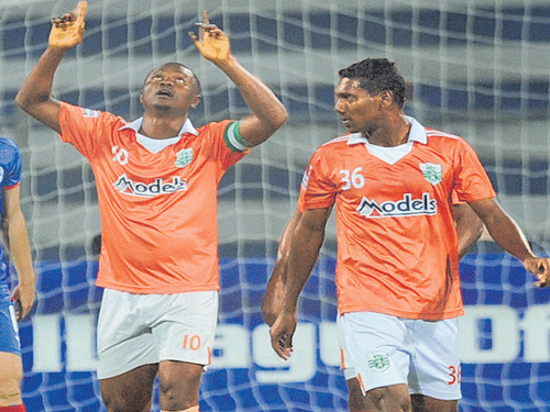 Grateful: Sporting's Odafa Okolie (left) celebrates after scoring against BFC on Saturday. DH PHOTO/ Kishor Kumar Bolar