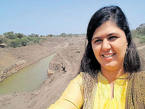 Rural Development Minister Pankaja Munde taking selfies in drought-affected areas.