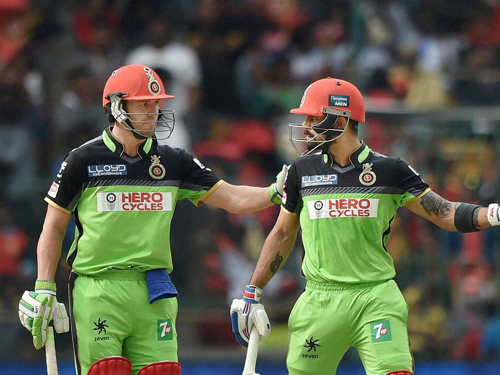 AB de Villiers blasted his way to his second IPL century (129 n.o., 52b, 10x4, 12x6) while Virat Kohli stroked his way to his third century (109, 55b, 5x4, 8x6) of the season as the Royal Challengers buried Lions in an avalanche of runs here at the Chinnaswamy stadium on Saturday.  DH Photo