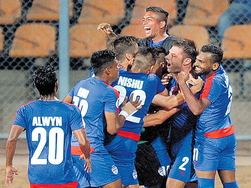 blue thunder: Bengaluru FC players celebrate a goal against Johor Darul in the AFC Cup semifinal on Wednesday. dh photos/ srikanta sharma r