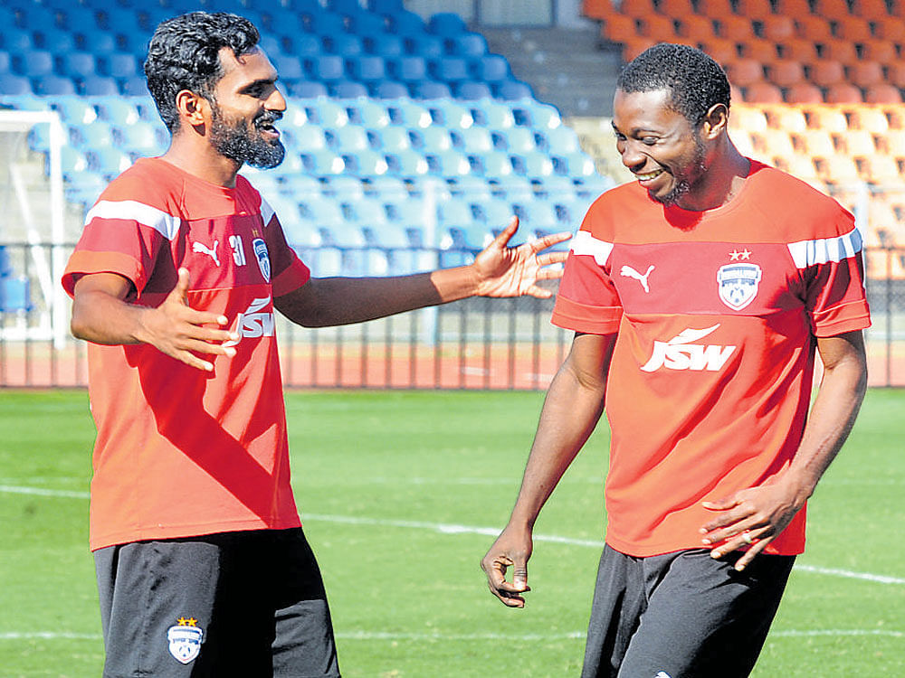 Come on mate! Bengaluru FC's CK Vineeth (left) and Roby Norales during a practice session. DH Photo/ Srikanta Sharma R