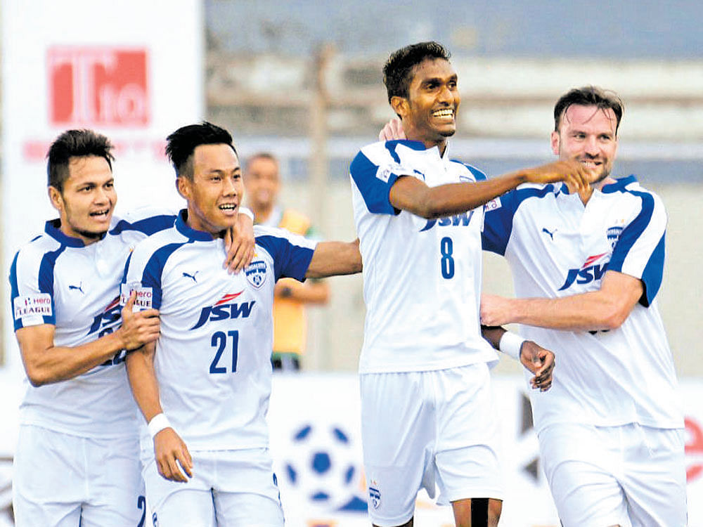 jubilant: Bengaluru FC's Lenny Rodrigues (8) celebrates with team-mates after scoring against Minerva. I-League media