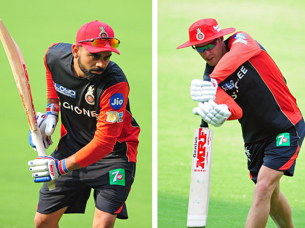 Inspirational: Royal Challengers Bangalore's Virat Kohli (left) and AB de Villiers knocked the ball around for a short period on Monday ahead of their opening game against champions Sunrisers Hyderabad. DH Photo/ Ranju P
