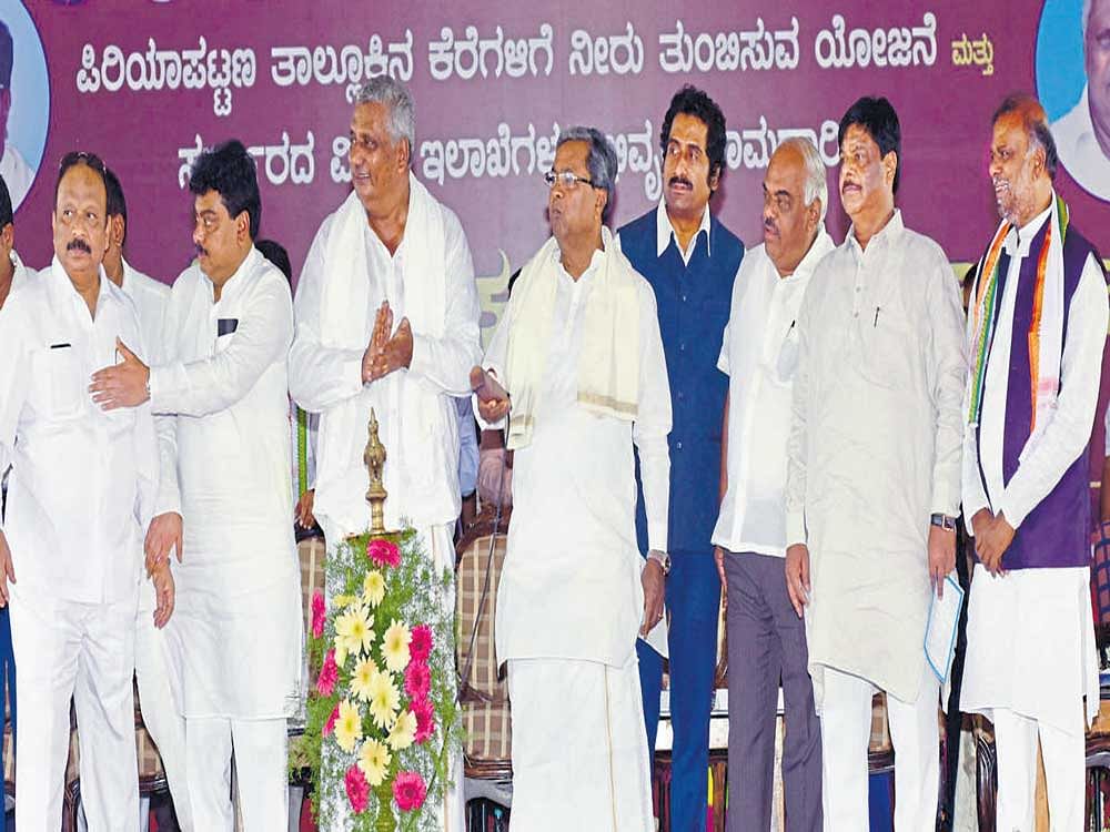 Chief Minister Siddaramaiah inaugurates works on various development projects at Muttinamulasoge village in Periyapatna taluk, Mysuru district, on Wednesday. Minister for Infrastructure, Urban Development, Information and Haj, Roshan Baig, Water Resources Minister M&#8200;B&#8200;Patil, MLA&#8200;K&#8200;Venkatesh, ministers K&#8200;R&#8200;Ramesh Kumar, H&#8200;C&#8200;Mahadevappa and H&#8200;Anjaneya are also seen. DH photo