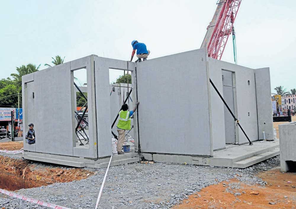 Installation of pre-fabricated structures is in progress for  Indira Canteen in Kadirenahalli. DH PHoto