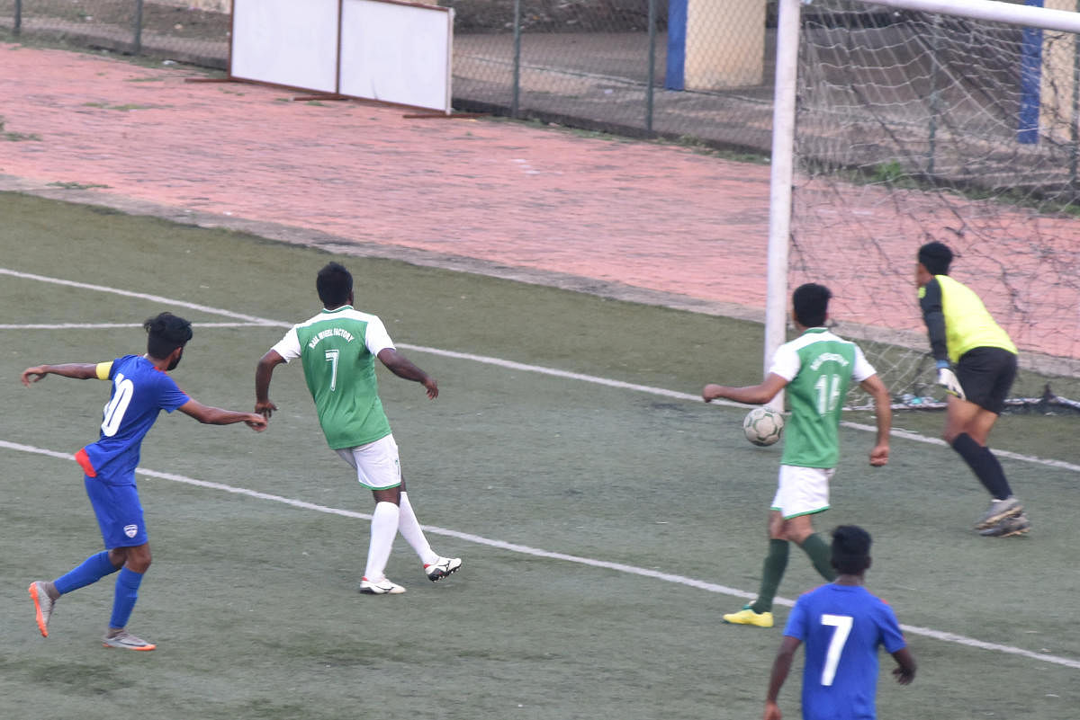 ON THE MARK Myron Mendes (left) of BFC scores against RWF in the Super Division Football League in Bengaluru on Sunday. DH PHOTO