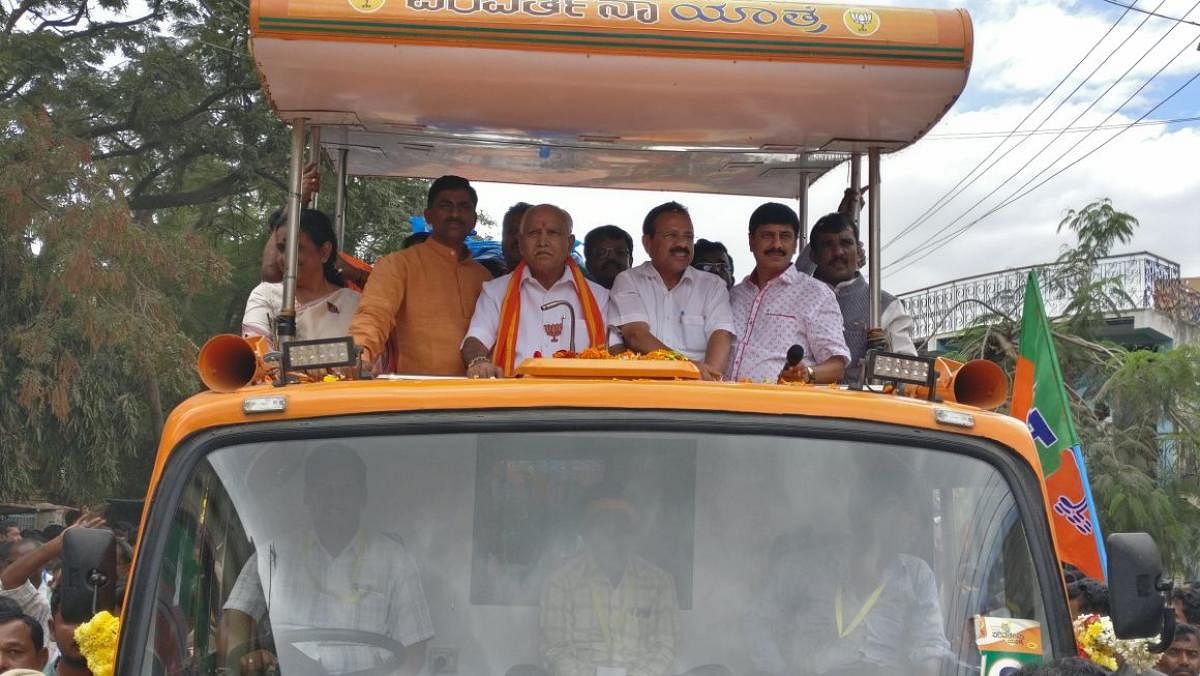BJP national general secretary in-charge Karnataka P Muralidhar Rao, party state president B S Yeddyurappa, Union Minister D V Sadananda Gowda are taken out in a procession ahead of the Parivarthana rally in Gauribidanur, Chikkaballapur district, on Friday.