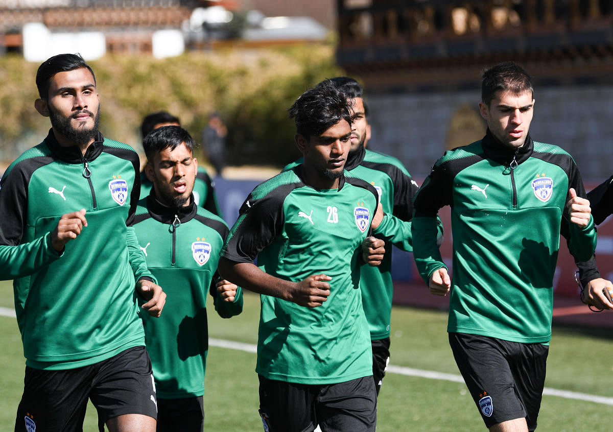 RARING TO GO Bengaluru FC players go through the paces during a training session at the Changlimithang Stadium in Thimphu on Monday. BFC MEDIA