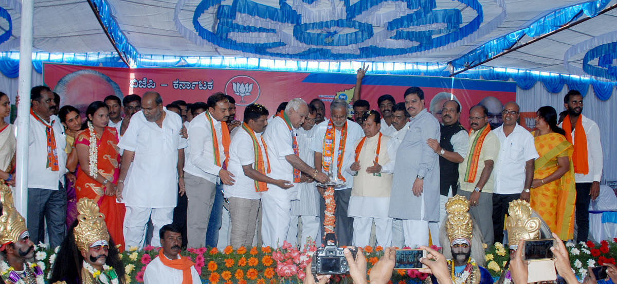 BJP state president B S Yeddyurappa inaugurates the 'Parivarthana Yatre' rally, in front of Ambedkar Bhavan at HD Kote in Mysuru district on Monday. BJP leaders S Suresh Kumar and M Shivanna are seen.