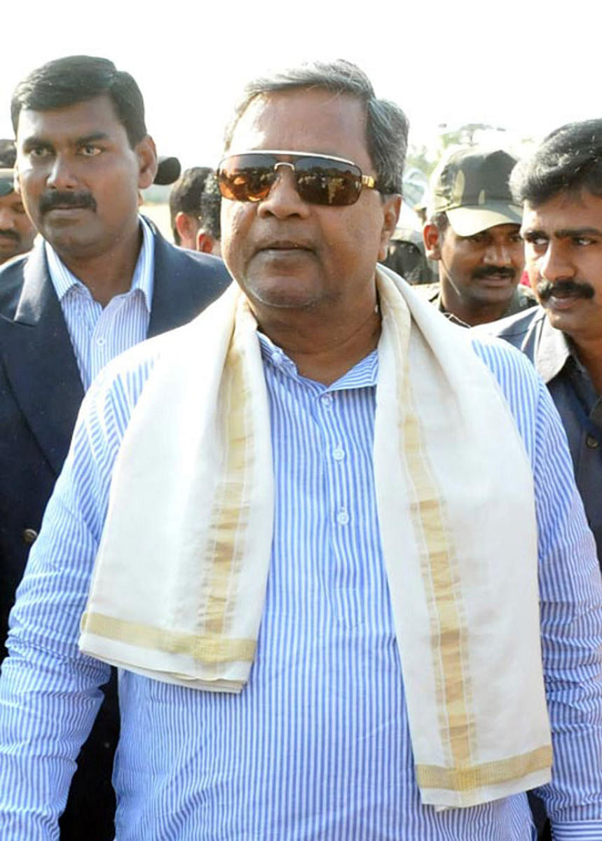 Chief Minister Siddaramaiah at the Hungund helipad in Bagalkot district on Monday. DH Photo.