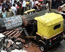 A tree fell on a auto rickshaw during rain on Alexander street at Richmond Town, in Bangalore on Saturday. Driver died in this accident.-KPN