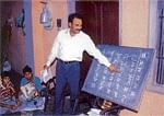 Pandit Rao Dharennavar teaching Punjabi to school kids in a village near Chandigarh.