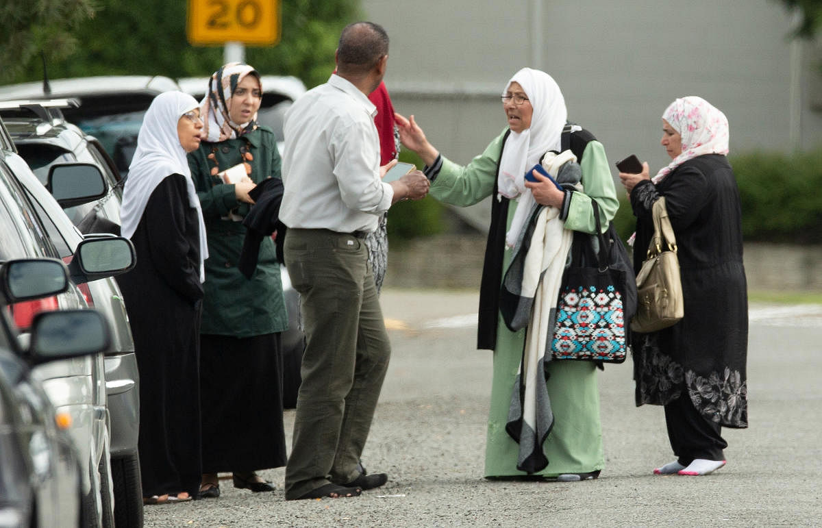 Members of a family react outside the mosque following a shooting at the Al Noor mosque in Christchurch, New Zealand. (Reuters Photo)