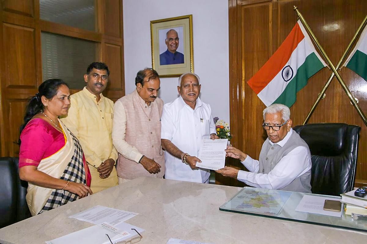 BJP's chief ministerial candidate B S Yeddyurappa meets Karnataka Governor Vajubhai Vala after the Karnataka Assembly election 2018 results, in Bengaluru on Tuesday.