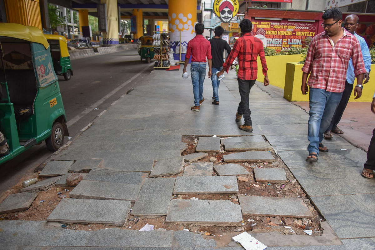 A broken footpath near the Indiranagar metro station. DH PHOTO/SK DINESH