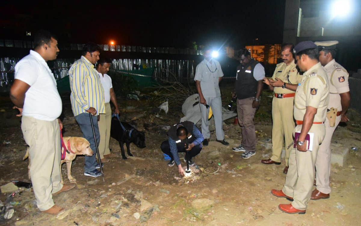 The Bomb Detection and Disposal Squad inspect the site of the blast on Tuesday. DH file photo