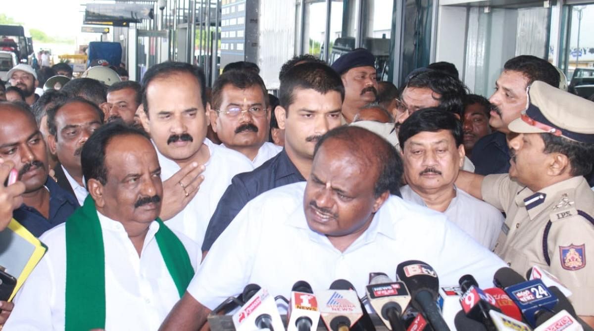 Chief Minister H D Kumaraswamy addresses reporters at the Hubballi airport on Sunday. DH photo.