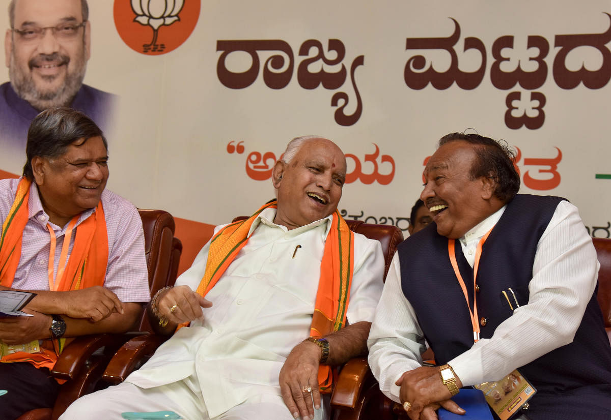 BJP state president B S Yeddurappa shares a light moment with party leaders K S Eshwarappa and Jagadish Shettar at a party meeting in Bengaluru on Wednesday. DH photo