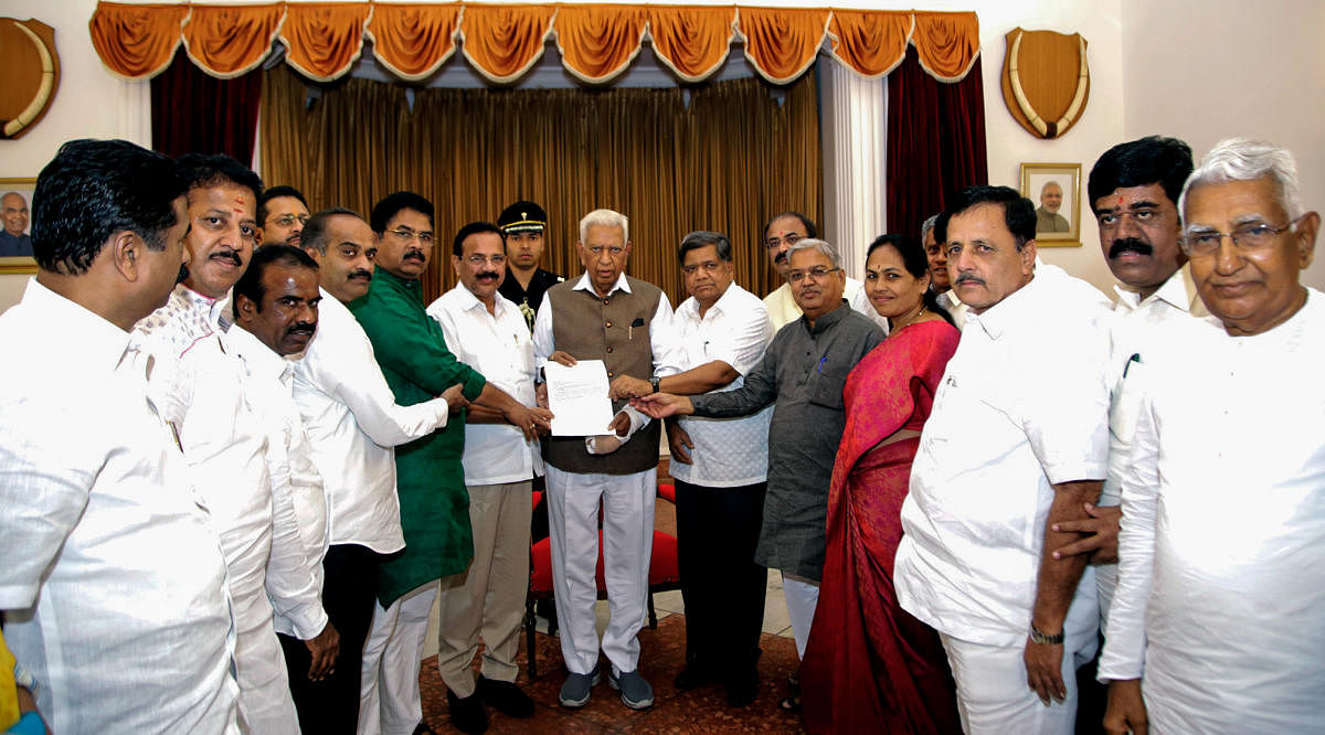A BJP delegation, led by Union Minister D V Sadananda Gowda, submits a memorandum to Governor Vajubhai Vala seeking action against Chief Minister H D Kumaraswamy, at Raj Bhavan in Bengaluru on Friday.