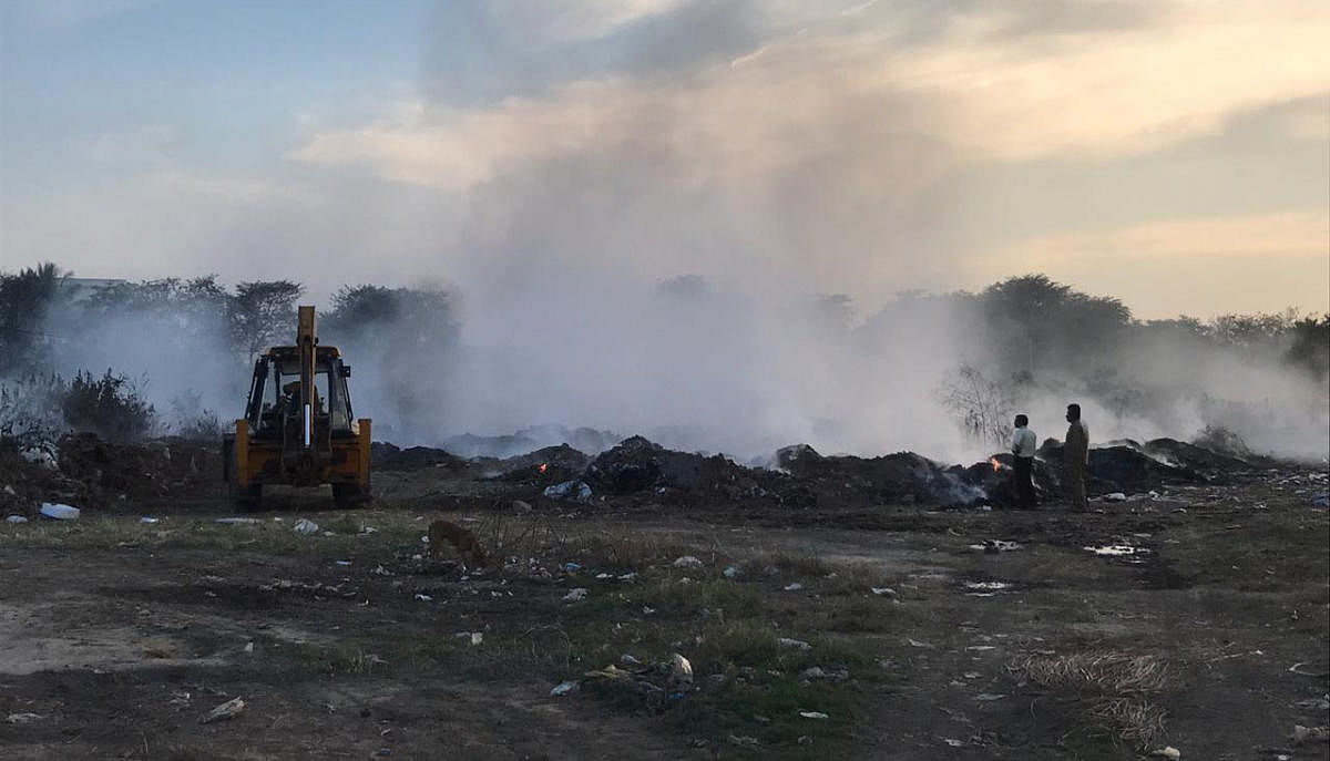 Garbage burning for long hours at HAL institute premises on Monday.