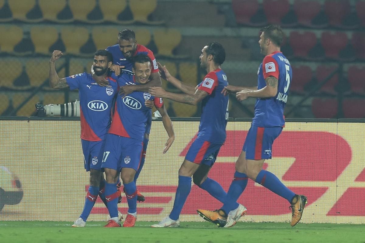 SAVIOUR: Chencho Gyeltshen of Bengaluru FC (second from right) celebrates with team-mates after scoring his team’s equaliser against NorthEast United FC. ISL MEDIA 