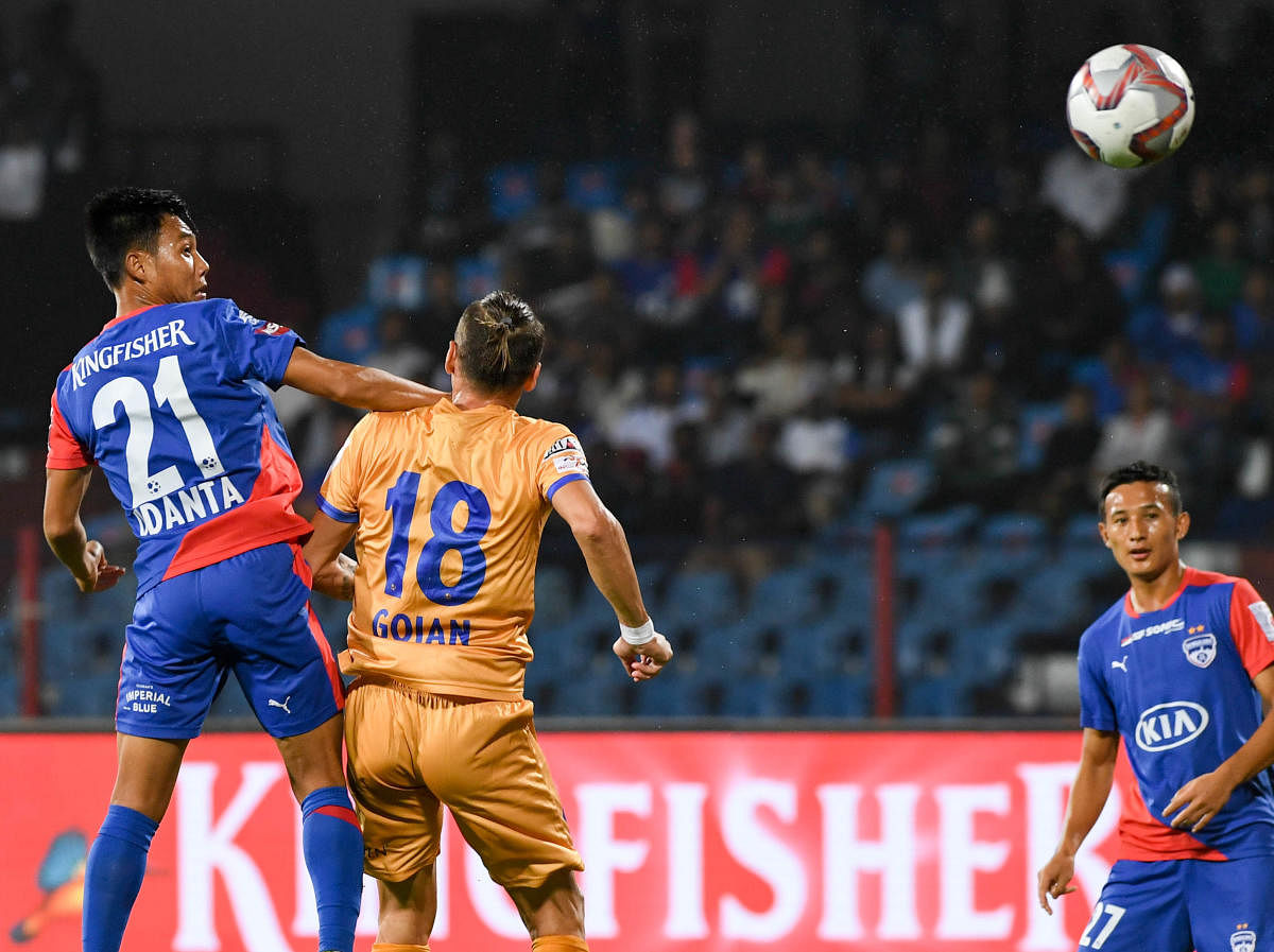 ON TARGET: BFC’s Udanta Singh heads home a cross from Rahul Bheke against Mumbai City FC. DH Photo/ B H Shivakumar