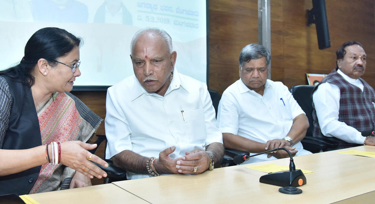 HEADS TOGETHER: (From left) BJP Karnataka Election co-in-charge Kiran Maheshwari, party state president B S Yeddyurappa, leaders Jagadish Shettar and K S Eshwarappa during the BJP Legislature Party meeting at its office in Bengaluru on Tuesday. DH Photo/J