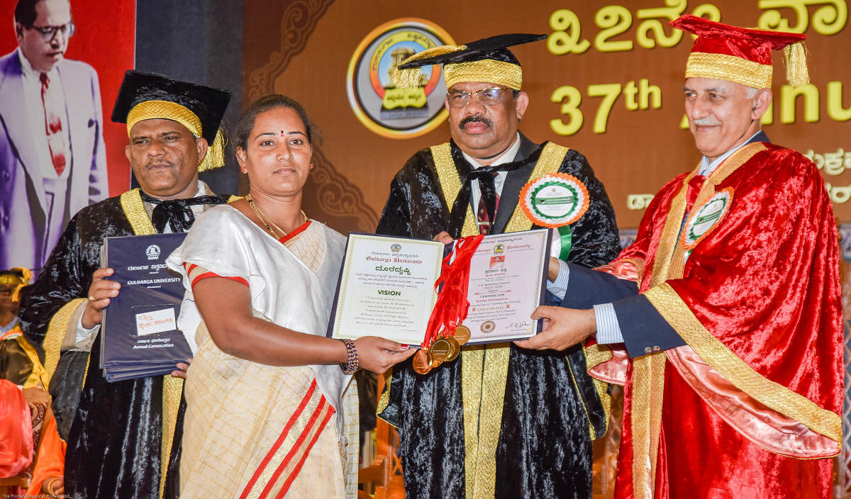 Shylaja Sharanagouda recieves 8 gold medals in MA (Kannada) from Vice Chancellor Prof S R Niranjana and former CFTRI director V Prakash at the 37th Convocation of Gulbarga University held in Kalaburagi on Friday. Registrar (Evaluation) Prof D M Madari is