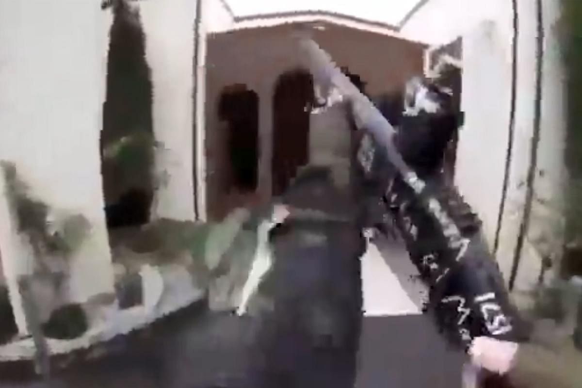 This image grab from a self-shot video that was streamed on Facebook Live on March 15, 2019 by the man who was involved in two mosque shootings in Christchurch shows the man holding a gun as he enters the Masjid al Noor mosque. (AFP)