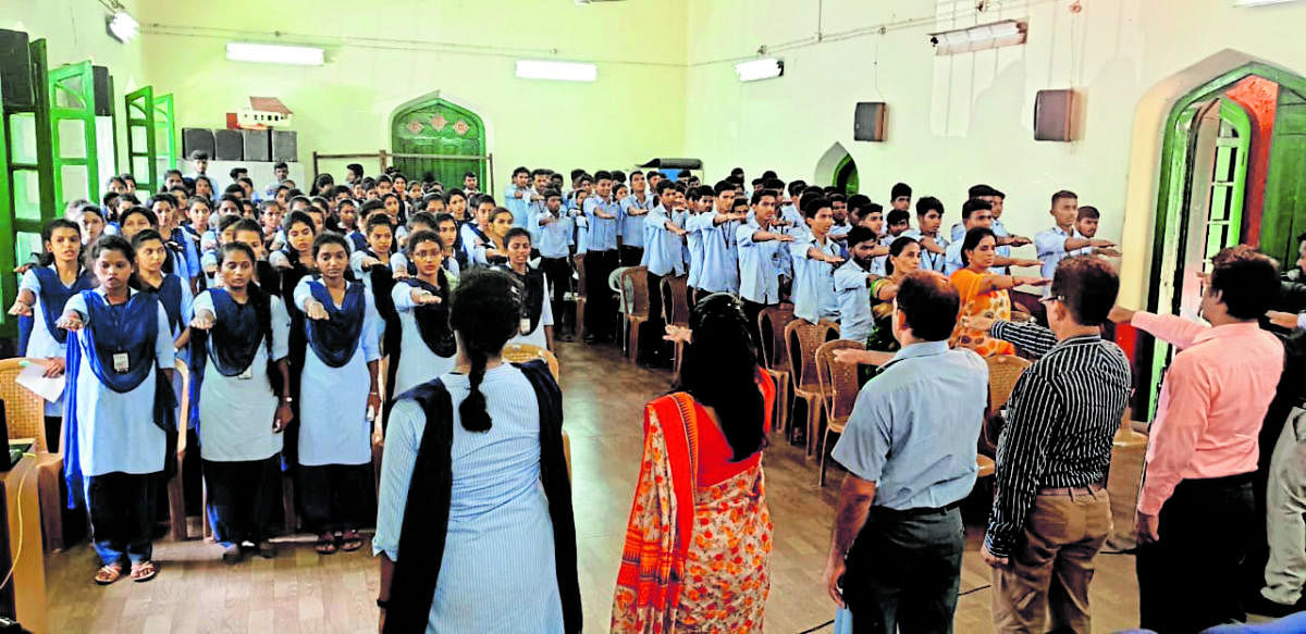 Students are administered oath on exercising franchise as a part of the awareness programme at University College in Mangaluru on Friday.