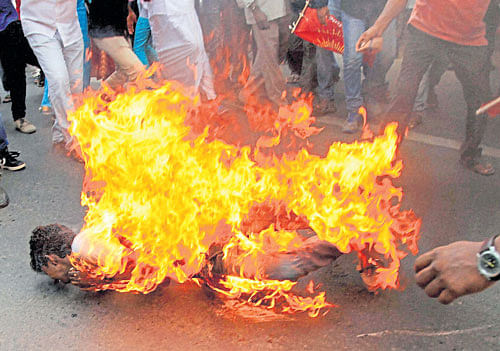 Fiery issue: A young man immolates himself during protests for Cauvery water in Chennai on Thursday. PTI