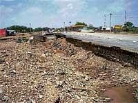 Pouring trouble: A damaged road after heavy rain in Jaisalmer on Wednesday.  PTI