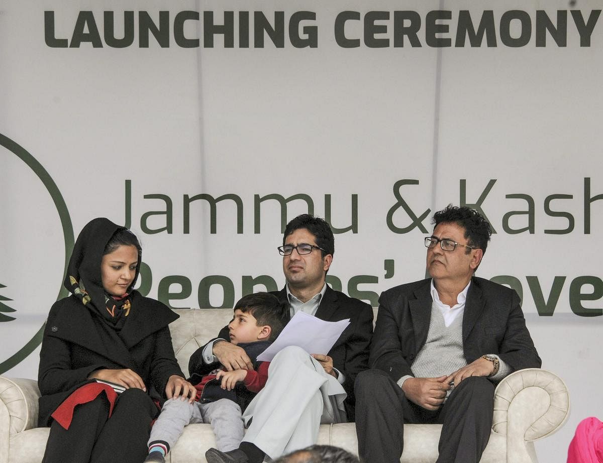Former IAS officer Shah Faesal (C) with former JNU student leader and activist Shehla Rashid during a rally organised to launch a new political party 'Jammu and Kashmir Peoples' Movement', in Srinagar on Sunday. PTI photo
