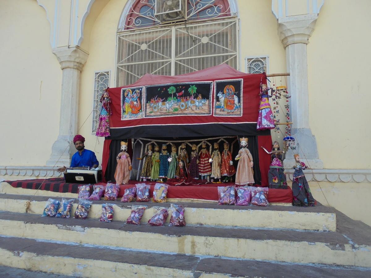The show is on: A street puppeteer; (below) an exhibit in the Folk Art Museum, Udaipur. Photos by author