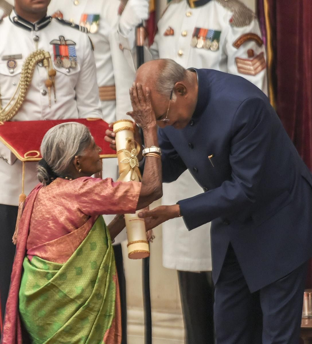 President Ram Nath Kovind being blessed by renowned environmentalist Saalumarada Thimmakka after she was awarded Padma Shri during 'Padma Awards 2019'. PTI