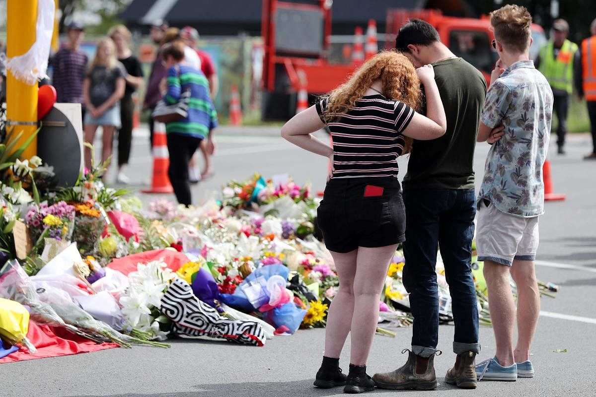 Residents pay their respects by placing flowers for the victims of the mosques attacks in Christchurch. AFP Photo