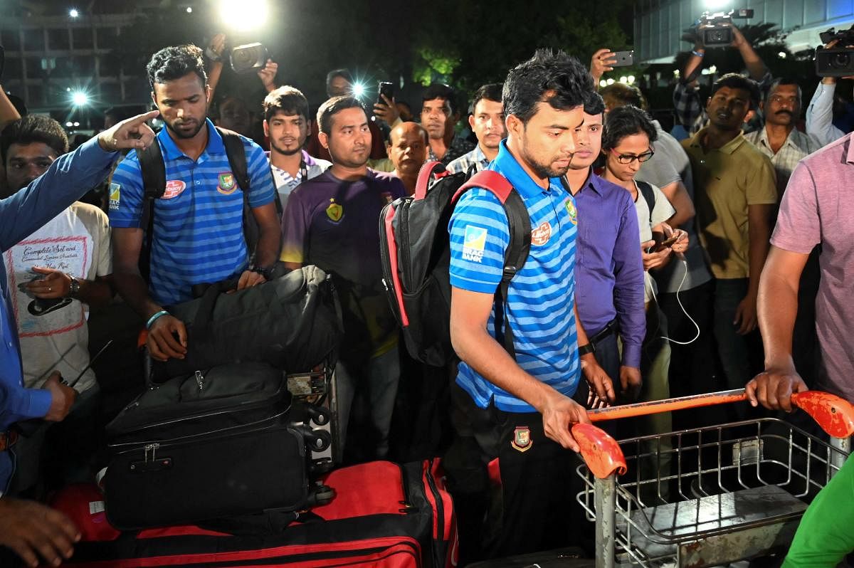 BACK HOME: Bangladesh cricketers arrive at the Dhaka airport from New Zealand on Saturday. AFP