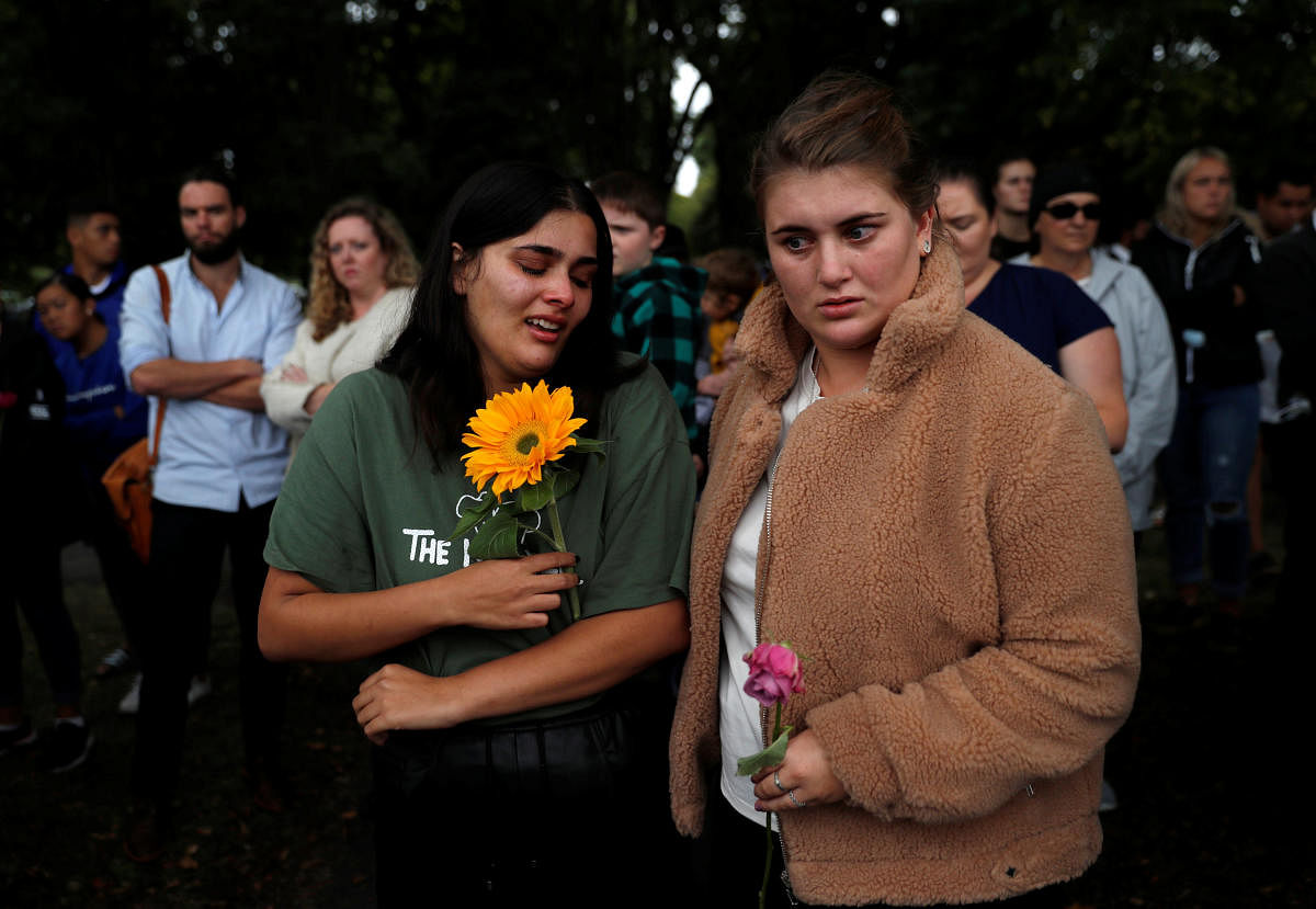 People react near Masjid Al Noor mosque in Christchurch, New Zealand, March 17, 2019. REUTERS