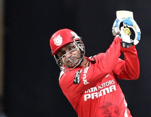 Virender Sehwag of the Kings XI Punjab plays a shot during an IPL 7 match against Chennai Super Kings in Mumbai on Friday. PTI Photo