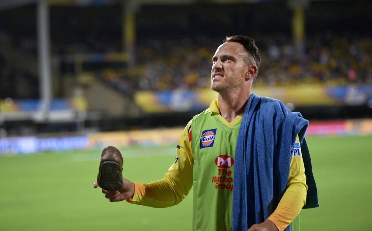 CSKs' Faf du Plesis shows a shoe hurled into the ground by an activist of a pro-Tamil outfit during the IPL match between Chennai Super Kings and Kolkata Knight Riders, in Chennai on Tuesday. PTI