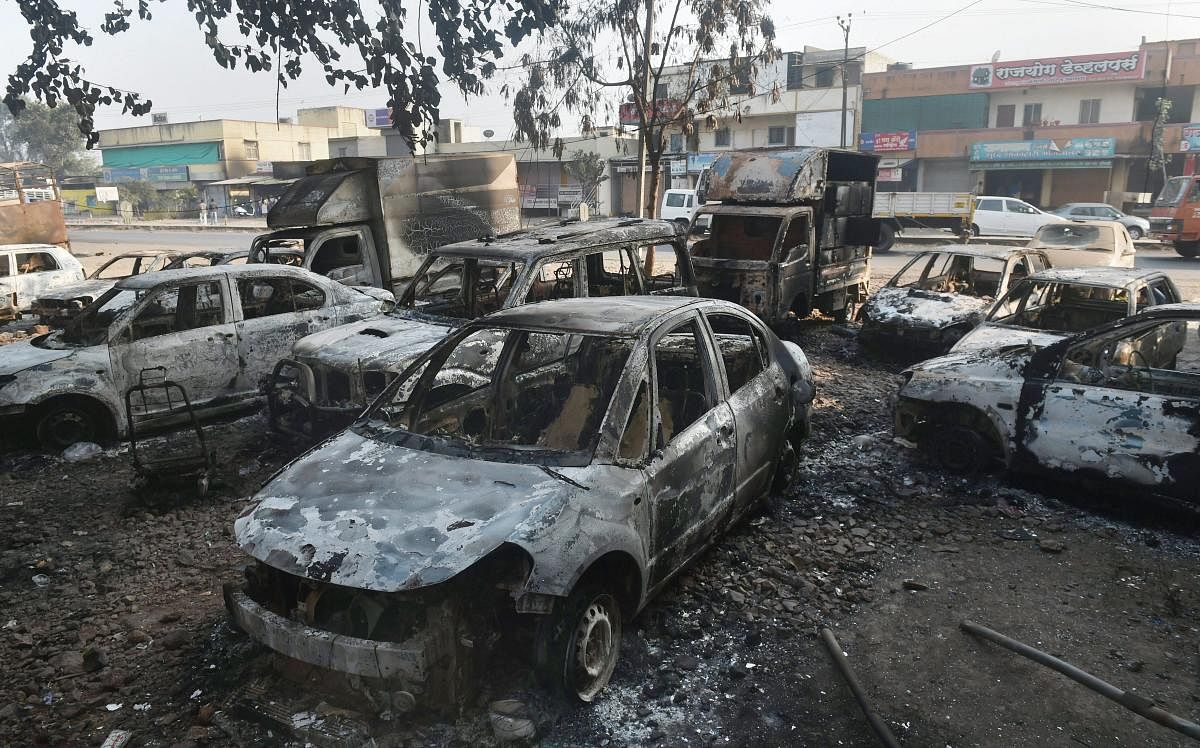 Charred vehicles following the violence during celebrations of 200th anniversary of the Battle of Bhima Koregaon, near Pune on Tuesday. (PTI File Photo)