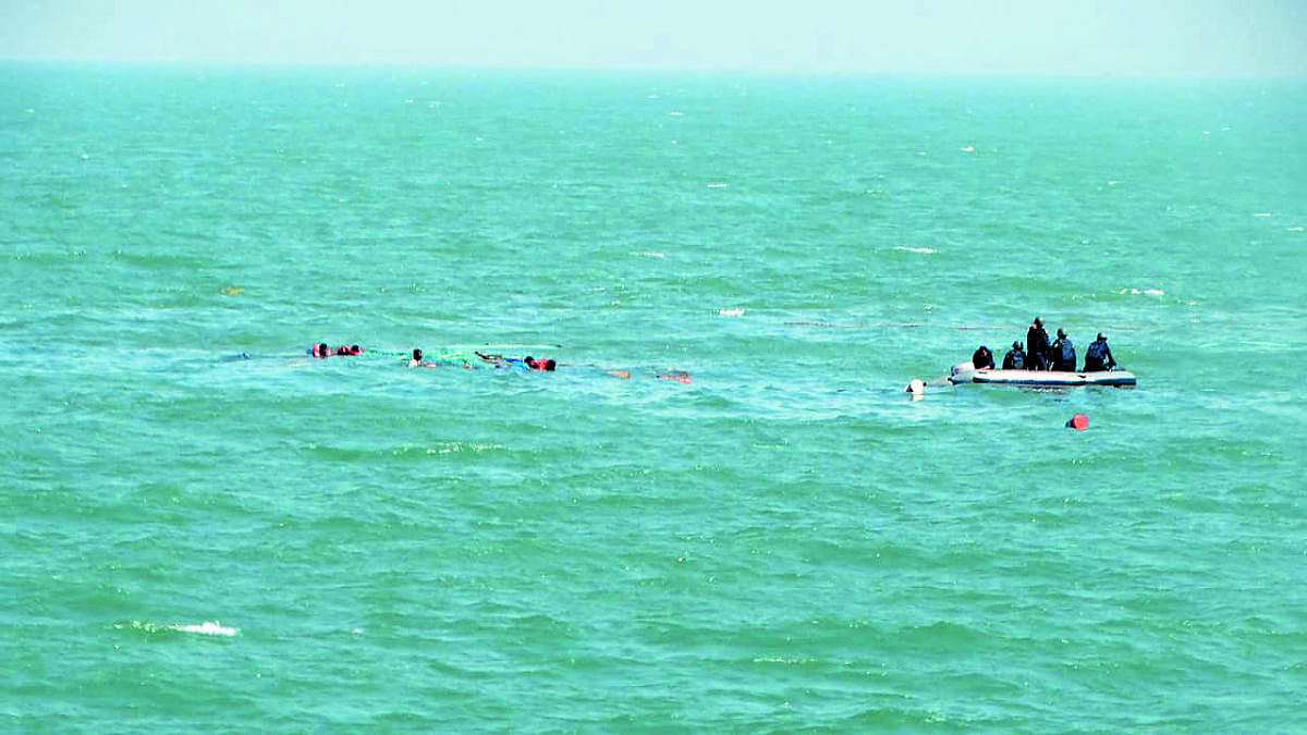 Six drowning crew from a sunken Tug, Revti, being rescued by Indian Coast Guard Ship Amartya on Monday.
