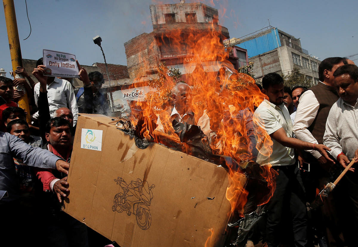 Traders burn Chinese products during a protest against, what they say, China preventing UN Security Council committee from blacklisting Masood Azhar the head of Pakistan-based militant group JeM, in New Delhi. PTI Photo