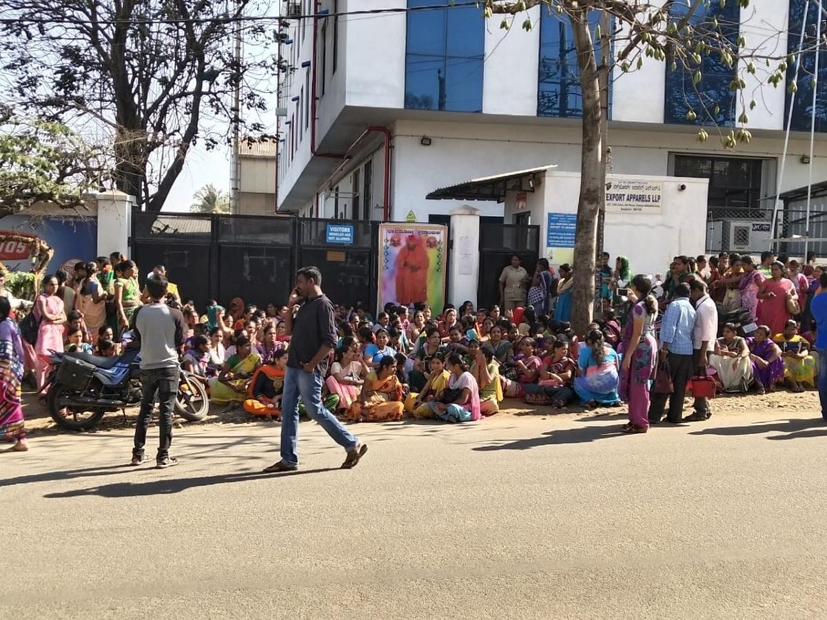 Nearly 200 women workers of a garment factory in Peenya protested against its general manager and his subordinates who assaulted their 36-year-old co-worker. (DH Photo)