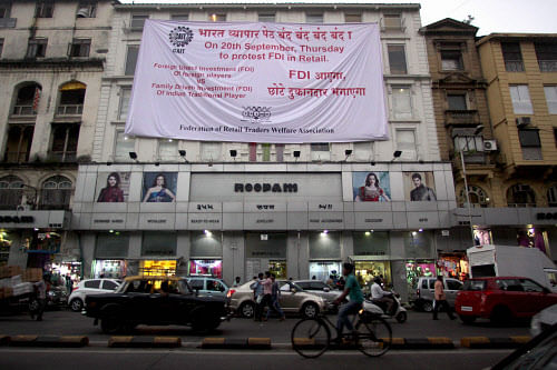 A huge poster with a message announcing the 'Bharat Bandh' scheduled on 20th September to oppose the Foriegn Direct Investment (FDI) put up by an association of local retail traders in Mumbai on Tuesday. PTI Photo by Mitesh Bhuvad