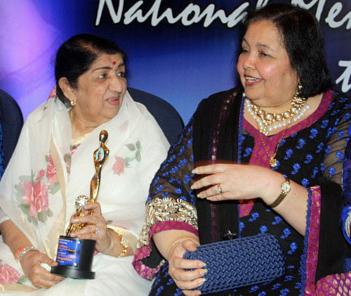Veteran playback singer Lata Mangeshkar and Pamela Chopra during the Yash Chopra National Memorial awards night in Mumbai on Saturday. PTI Photo