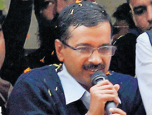 Arvind Kejriwal speaks to supporters in New Delhi on Sunday. PTI