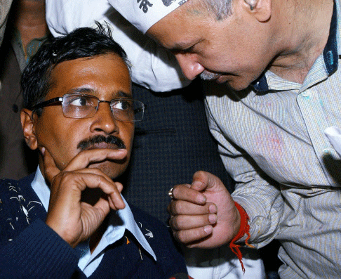 Aam Aadmi Party convener Arvind Kejriwal with Manish Sishodia during a press conference . File -PTI photo