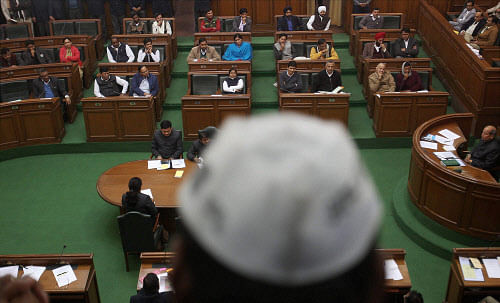 Delhi Chief Minister Arvind Kejriwal with AAP MLAs during confidence vote in Delhi Legislative Assembly in New Delhi on Thursday. PTI Photo by Manvender Vashist